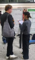 Jiaxin discussing in front of her poster.