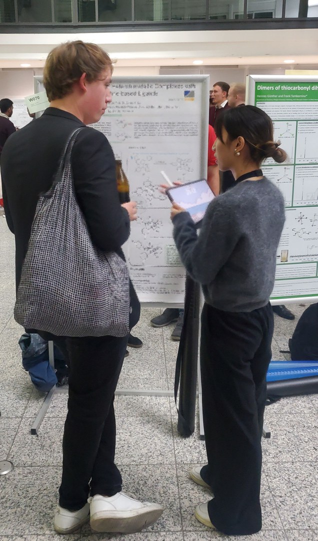 Jiaxin discussing in front of her poster.