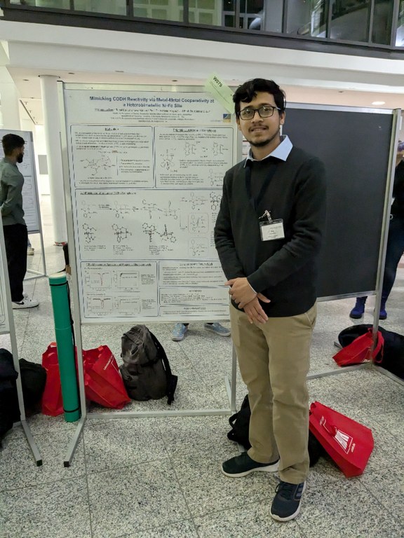 Krishnendu discussing in front of his poster.