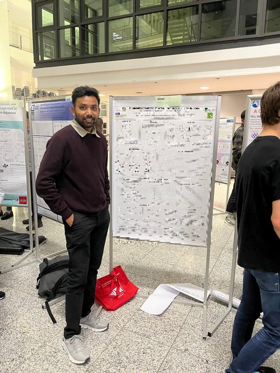 Sudip discussing in front of his poster.